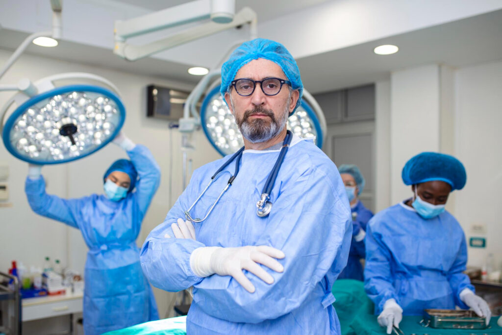 Image of a healthcare professional in surgical gear discussing benign prostatic hyperplasia treatment options, highlighting expertise in the field.